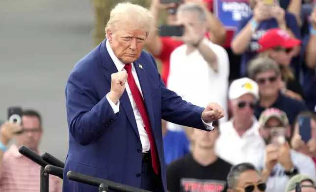 Republican presidential nominee former President Donald Trump dances during a campaign event in Asheboro, N.C., Wednesday, Aug. 21, 2024. (AP Photo/Chuck Burton)