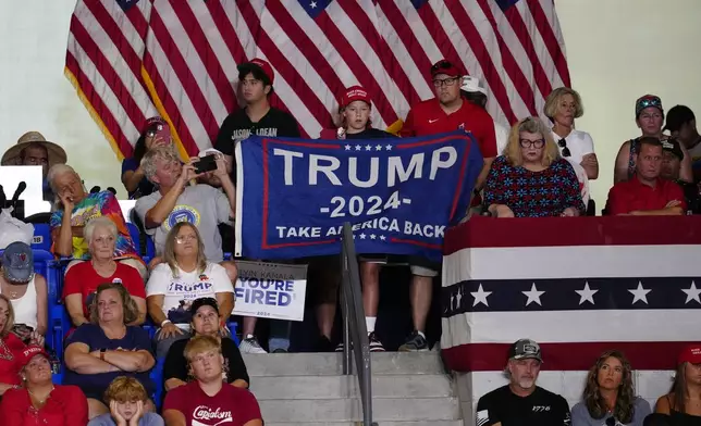 Supporters wait in the audience before Republican presidential candidate former President Donald Trump speaks at a campaign rally at Georgia State University in Atlanta, Saturday, Aug. 3, 2024. (AP Photo/Ben Gray)