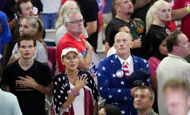 Supporters recite the Pledge of Allegiance at a campaign rally for Republican presidential candidate former President Donald Trump at Georgia State University in Atlanta, Saturday, Aug. 3, 2024. (AP Photo/Ben Gray)