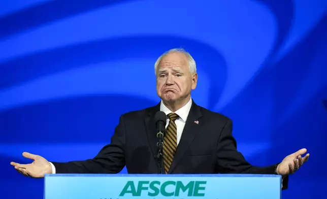 Democratic vice presidential nominee Minnesota Gov. Tim Walz reacts as he speaks at the American Federation of State, County and Municipal Employees (AFSCME) Convention in Los Angeles, Tuesday, Aug. 13, 2024. (AP Photo/Jae C. Hong)