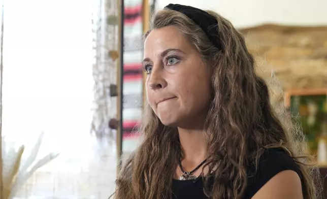 Kyleigh Thurman, one of the patients who is filing a federal complaint against an emergency room for not treating her ectopic pregnancy, talks about her experience at her studio, Wednesday, Aug. 7, 2024, in Burnet County, Texas. (AP Photo/Eric Gay)