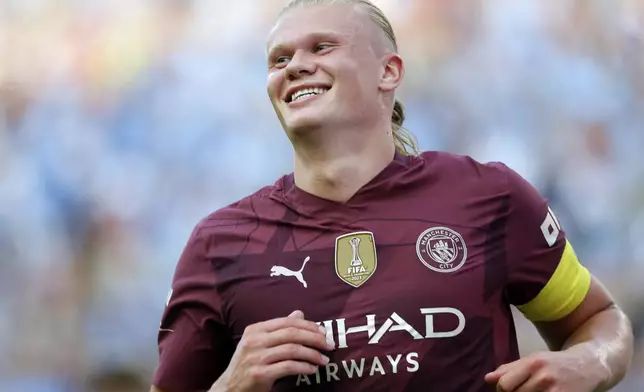 FILE - Manchester City's Erling Haaland smiles as he celebrates his second half goal against Chelsea during an FC Series soccer match, Saturday, Aug. 3, 2024 at Ohio Stadium in Columbus, Ohio. (AP Photo/Tom E. Puskar)