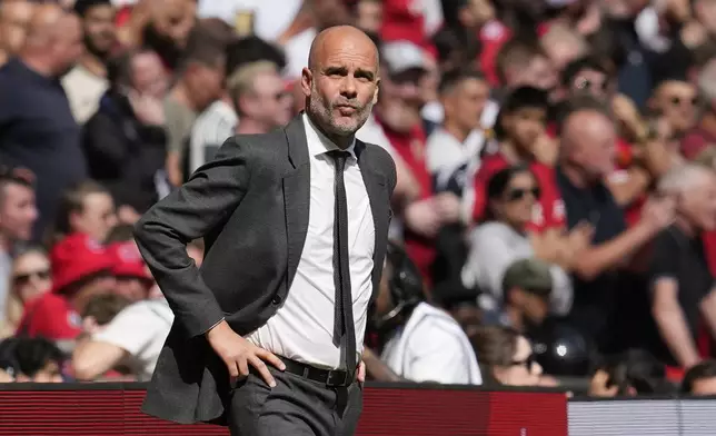 FILE - Manchester City's head coach Pep Guardiola gestures during the English FA Cup final soccer match between Manchester City and Manchester United at Wembley Stadium in London, Saturday, May 25, 2024. (AP Photo/Kin Cheung)