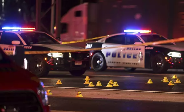 Evidence markers cover Interstate 35 early Thursday in Lewisville, Texas, on Friday, Aug 30, 2024. (Jason Janik/The Dallas Morning News via AP)