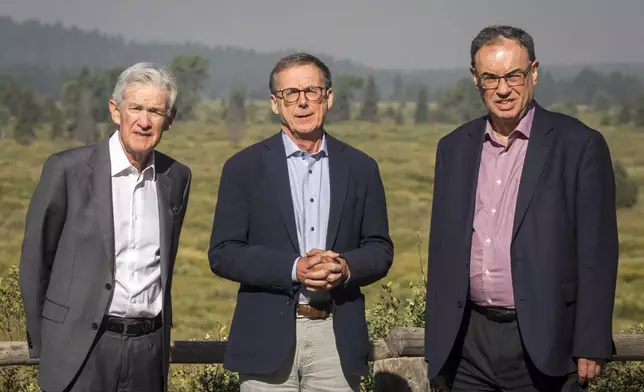 Federal Reserve Chairman Jerome Powell, left, Governor of the Bank of Canada Tiff Macklem, center, and Governor of the Bank of England Andrew Bailey pose for a photo at the Jackson Hole Economic Symposium at Jackson Lake Lodge in Grand Teton National Park near Moran, Wyo., on Aug. 23, 2024. (AP Photo/Amber Baesler)