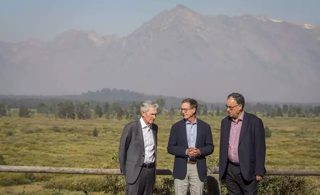 Federal Reserve Chairman Jerome Powell, left, Governor of the Bank of Canada Tiff Macklem, center, and Governor of the Bank of England Andrew Bailey chat outside the Jackson Hole Economic Symposium at Jackson Lake Lodge in Grand Teton National Park near Moran, WY on Aug. 23, 2024. (AP Photo/Amber Baesler)