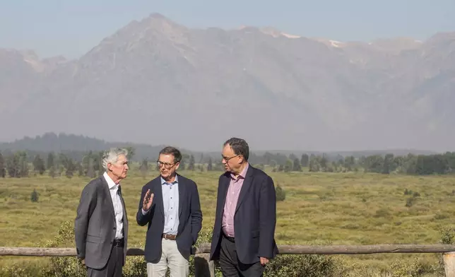 Federal Reserve Chairman Jerome Powell, left, Governor of the Bank of Canada Tiff Macklem, center, and Governor of the Bank of England Andrew Bailey chat outside the Jackson Hole Economic Symposium at Jackson Lake Lodge in Grand Teton National Park near Moran, Wyo., on Friday, Aug. 23, 2024. (AP Photo Amber Baesler)