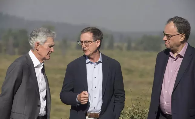 Federal Reserve Chairman Jerome Powell, left, Governor of the Bank of Canada Tiff Macklem, center, and Governor of the Bank of England Andrew Bailey pose for a photo at the Jackson Hole Economic Symposium at Jackson Lake Lodge in Grand Teton National Park near Moran, Wyo., on Aug. 23, 2024. (AP Photo/Amber Baesler)