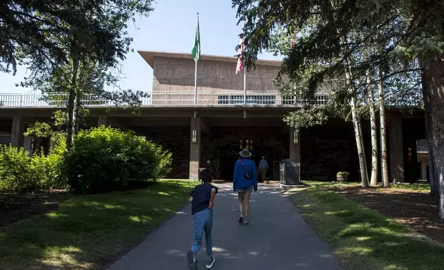 Guests approach Jackson Lake Lodge, the site of the Jackson Hole Economic Symposium, in Grand Teton National Park near Moran, Wyo., on Thursday, Aug. 22, 2024.