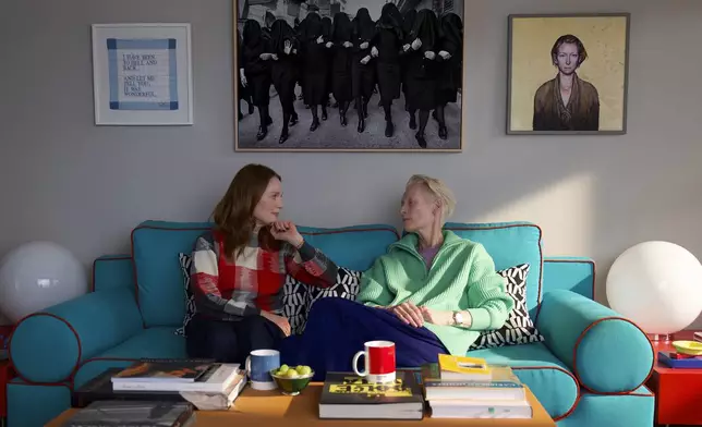 This image released by Sony Pictures Classics shows Julianne Moore, left, and Tilda Swinton in a scene from "The Room Next Door." (Sony Pictures Classics via AP)