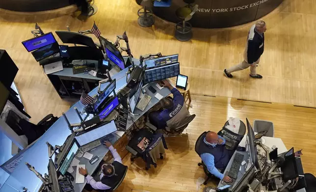 Traders work on the floor of the New York Stock Exchange, Wednesday, Aug. 7, 2024. (AP Photo/Richard Drew)