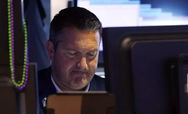 Trader Leon Montana works on the floor of the New York Stock Exchange, Monday, Aug. 5, 2024. (AP Photo/Richard Drew)