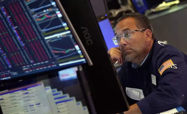 Specialist Anthony Matesic works at his post on the floor of the New York Stock Exchange, Monday, Aug. 5, 2024. (AP Photo/Richard Drew)