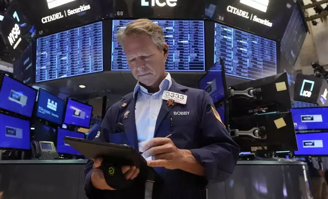 Trader Robert Charmak works on the floor of the New York Stock Exchange, Monday, Aug. 5, 2024. Nearly everything on Wall Street is tumbling as fear about a slowing U.S. economy worsens and sets off another sell-off for financial markets around the world. (AP Photo/Richard Drew)