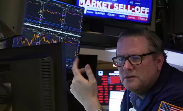 Specialist Gregg Maloney works at his post on the floor of the New York Stock Exchange, Monday, Aug. 5, 2024. Nearly everything on Wall Street is tumbling as fear about a slowing U.S. economy worsens and sets off another sell-off for financial markets around the world. (AP Photo/Richard Drew)