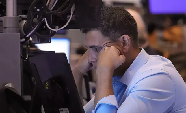 A trader works on the floor of the New York Stock Exchange, Wednesday, Aug. 7, 2024. (AP Photo/Richard Drew)