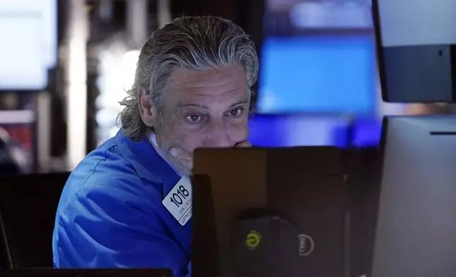 FILE - Trader John Romolo works on the floor of the New York Stock Exchange, Aug. 2, 2024. Japan's benchmark Nikkei 225 stock index has lost 12.4% on Monday, August 5, 2024, in the latest bout of sell-offs that are jolting world markets. (AP Photo/Richard Drew, File)