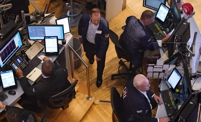 Traders work on the floor of the New York Stock Exchange, Monday, Aug. 5, 2024. (AP Photo/Richard Drew)