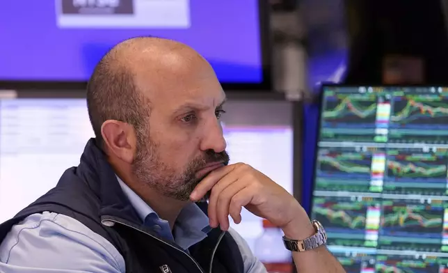 Specialist James Denaro works at his post on the floor of the New York Stock Exchange, Friday, Aug. 2, 2024. (AP Photo/Richard Drew)