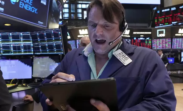 Trader Michael Milano works on the floor of the New York Stock Exchange, Monday, Aug. 5, 2024. (AP Photo/Richard Drew)