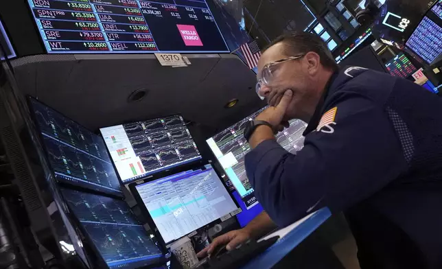 Specialist Anthony Matesic works at his post on the floor of the New York Stock Exchange, Monday, Aug. 5, 2024. (AP Photo/Richard Drew)