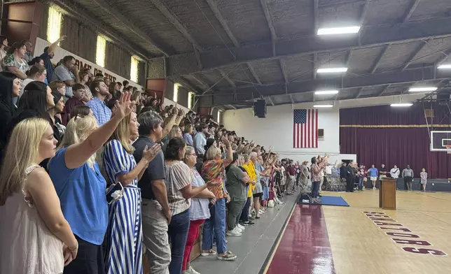 Students, teachers and community members pack the Morgan Academy gym to honor Caden Tellier, the football player and high school student who died from an injury in a game Friday night. The memorial service opened with one of Caden's favorite songs in Selma, Ala., Monday, Aug. 26, 2024. (AP Photo/Safiyah Riddle)