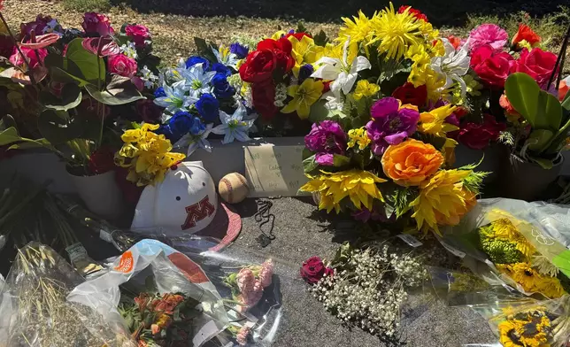 A memorial for 16-year-old Caden Tellier is seen in the parking lot of Morgan Academy in Selma, Ala., Monday, Aug. 26, 2024. (AP Photo/Safiyah Riddle)