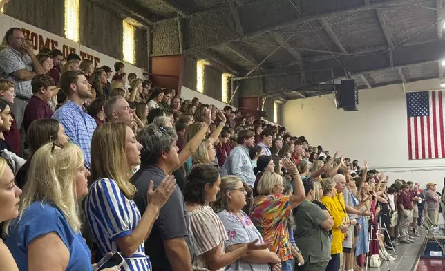 Students, teachers and community members pack the Morgan Academy gym to honor Caden Tellier, the football player and high school student who died from an injury on a game Friday night. The memorial service opened with one of Caden's favorite songs in Selma, Ala., Monday, Aug. 26, 2024. (AP Photo/Safiyah Riddle)