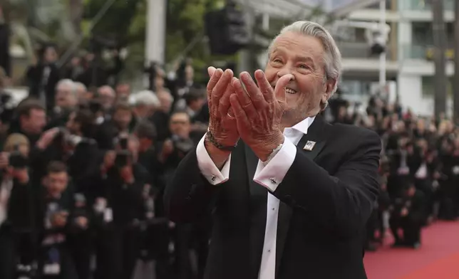 FILE - In this May 19, 2019 file photo, French actor Alain Delon poses for photographers upon arrival at the premiere of the film 'A Hidden Life' at the 72nd international film festival, Cannes, southern France. Alain Delon, the internationally acclaimed French actor who embodied both the bad guy and the policeman and made hearts throb around the world, has died at age 88, French media reported. (AP Photo/Petros Giannakouris, File)