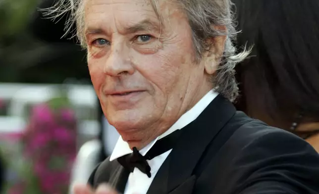 FILE - French Actor Alain Delon arrives for the screening of "Chacun Son Cinema" (To Each His Own Cinema), at the 60th International film festival in Cannes, southern France, on May 20, 2007. Alain Delon, the internationally acclaimed French actor who embodied both the bad guy and the policeman and made hearts throb around the world, has died at age 88, French media reported. (AP Photo/Andrew Medichini, File)