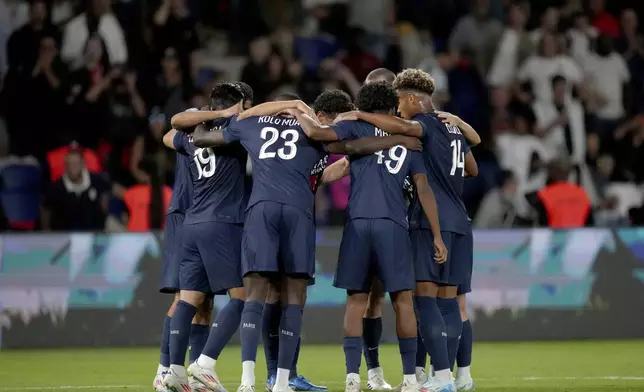 PSG players celebrate after Lee Kang-in scored their sixth goal during the French League 1 soccer match between Paris Saint-Germain and Montpellier at the Parc des Princes in Paris, Friday, Aug. 23, 2024. (AP Photo/Thibault Camus)