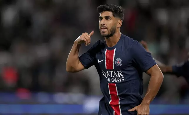 PSG's Marco Asensio celebrates after scoring his side's second goal during the French League 1 soccer match between Paris Saint-Germain and Montpellier at the Parc des Princes in Paris, Friday, Aug. 23, 2024. (AP Photo/Thibault Camus)