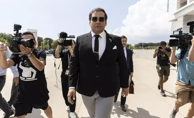 Former U.S. Rep. George Santos arrives at court in Central Islip, N.Y., Monday, Aug. 19, 2024. (AP Photo/Stefan Jeremiah)