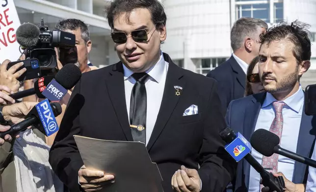 Former U.S. Rep George Santos speaks to the media outside the federal courthouse in Central Islip, N.Y. on, Monday, Aug., 19, 2024. (AP Photo/Stefan Jeremiah)