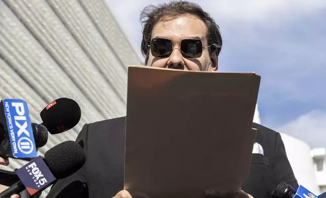 Former U.S. Rep George Santos speaks to the media outside the federal courthouse in Central Islip, N.Y. on, Monday, Aug., 19, 2024. (AP Photo/Stefan Jeremiah)