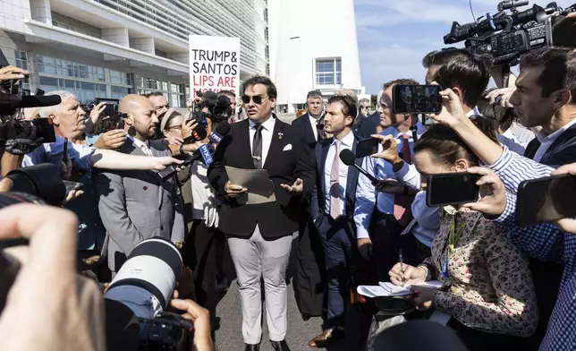 Former U.S. Rep George Santos speaks to the media outside the federal courthouse in Central Islip, N.Y. on, Monday, Aug., 19, 2024. (AP Photo/Stefan Jeremiah)