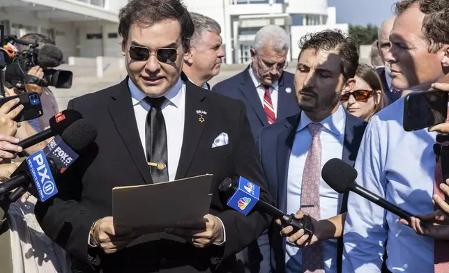 Former U.S. Rep George Santos speaks to the media outside the federal courthouse in Central Islip, N.Y. on, Monday, Aug., 19, 2024. (AP Photo/Stefan Jeremiah)