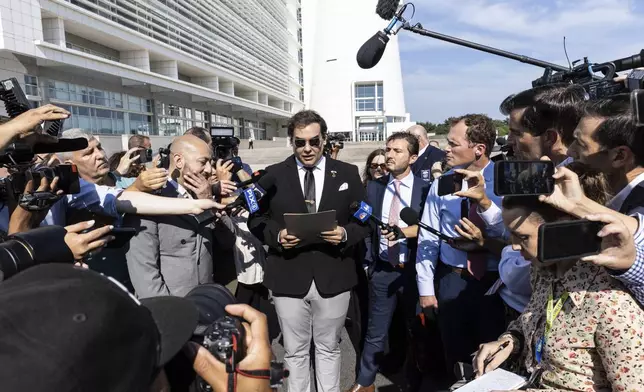 Former U.S. Rep George Santos speaks to the media outside the federal courthouse in Central Islip, N.Y. on, Monday, Aug., 19, 2024. (AP Photo/Stefan Jeremiah)