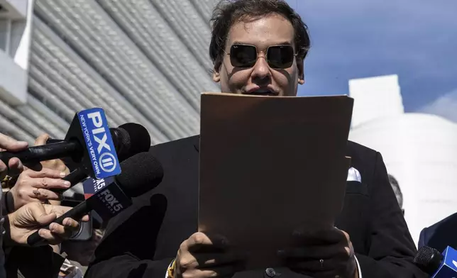 Former U.S. Rep George Santos speaks to the media outside the federal courthouse in Central Islip, N.Y. on, Monday, Aug., 19, 2024. (AP Photo/Stefan Jeremiah)