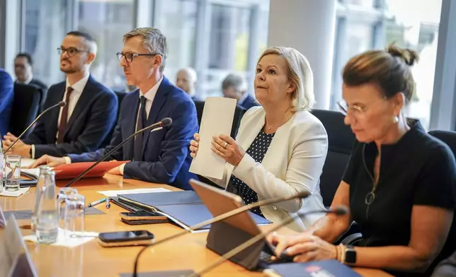 Federal Minister of the Interior and Home Affairs Nancy Faeser, second from right, attends the special session of the Bundestag's Committee on Internal Affairs, in Berlin, Friday, Aug. 30, 2024. Germany deported Afghan nationals to their homeland on Friday for the first time since August 2021, when the Taliban returned to power. (Kay Nietfeld/dpa via AP)