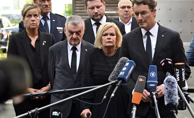 Hendrik W'st, right, Minister President of North Rhine-Westphalia, Federal Minister of the Interior Nancy Faeser, second right, and Herbert Reul, third right, Minister of the Interior of North Rhine-Westphalia, speak at a press conference following the Friday attack at the festival, in Solingen, Germany, Saturday, Aug. 24, 2024. (Henning Kaiser/dpa via AP)