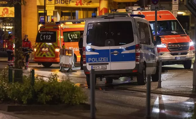 Emergency vehicles near the scene where people were killed and injured in an attack at a festival in Solingen, western Germany, the German dpa news agency reported, Friday, Aug. 23, 2024. (Gianni Gattus/dpa via AP)