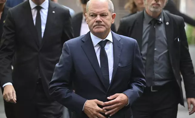 Germany Chancellor Olaf Scholz visits the scene of a knife attack, in Solingen, Germany, Monday, Aug. 26, 2024. (Henning Kaiser/Pool Photo via AP)