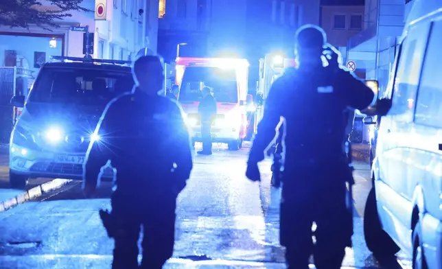 Police and ambulances near the scene where people were killed and injured in an attack at a festival in Solingen, western Germany, the German dpa news agency reported, Friday, Aug. 23, 2024. (Gianni Gattus/dpa via AP)