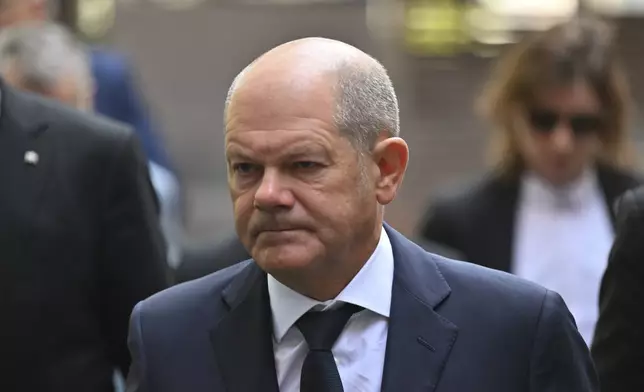 Germany Chancellor Olaf Scholz visits the scene of a knife attack, in Solingen, Germany, Monday, Aug. 26, 2024. (Henning Kaiser/Pool Photo via AP)