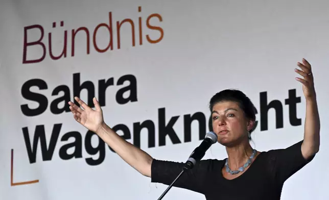 Sahra Wagenknecht, Chairwoman of the Sahra Wagenknecht Alliance (BSW), stands on stage during the election campaign event on Erfurt Cathedral Square, Germany, Thursday Aug. 29, 2024. (Martin Schutt/dpa via AP)