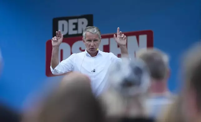 Bjoern Hoecke, top candidate of the far-right Alternative for Germany party, or AfD, speaks on an election campaign rally of the party for upcoming state elections in Suhl, Germany, Tuesday, Aug. 13, 2024. In the federal state Thuringia, in former East Germany, the citizens are called to vote for a new state parliament on Sept. 1, 2024. (AP Photo/Markus Schreiber)