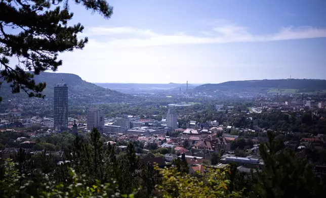 A view of the city center of Jena, the economy hub of German federal state Thuringia, with the Jenoptik head office center right, photographed from the Landgraf viewing point Monday, Aug. 12, 2024. (AP Photo/Markus Schreiber)