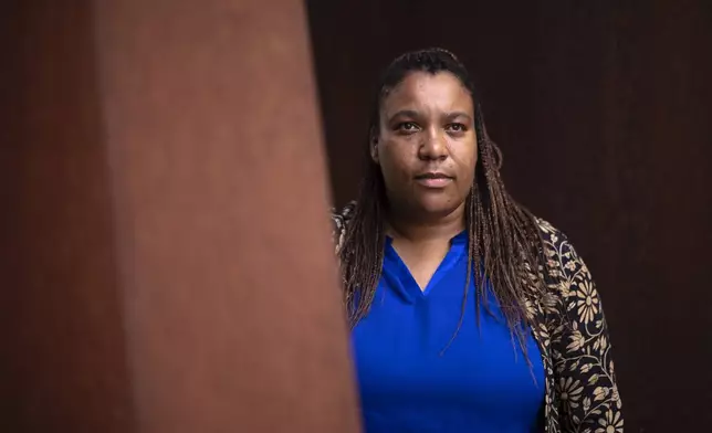 Doreen Denstaedt, German federal state Thuringia's minister for migration, justice and consumer protection, poses for a portrait prior to an interview with The Associated Press in Erfurt, Germany, Wednesday, Aug. 14, 2024. Denstaedt, the daughter of a Black father from Tanzania and a white, German mother, was born and grew up in Thuringiain and is a member of the Green Party. (AP Photo/Markus Schreiber)