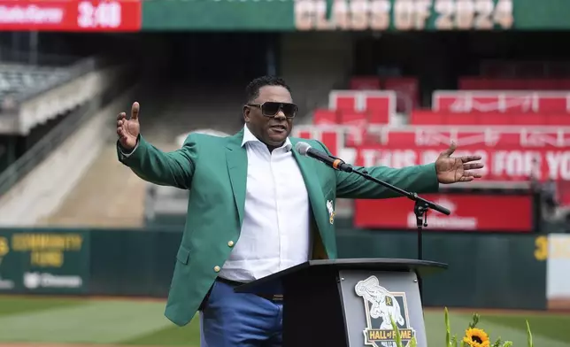 Former Oakland Athletics player Miguel Tejada speaks after being inducted into the team's Hall of Fame before a baseball game against the San Francisco Giants, Saturday, Aug. 17, 2024, in Oakland, Calif. (AP Photo/Godofredo A. Vásquez)